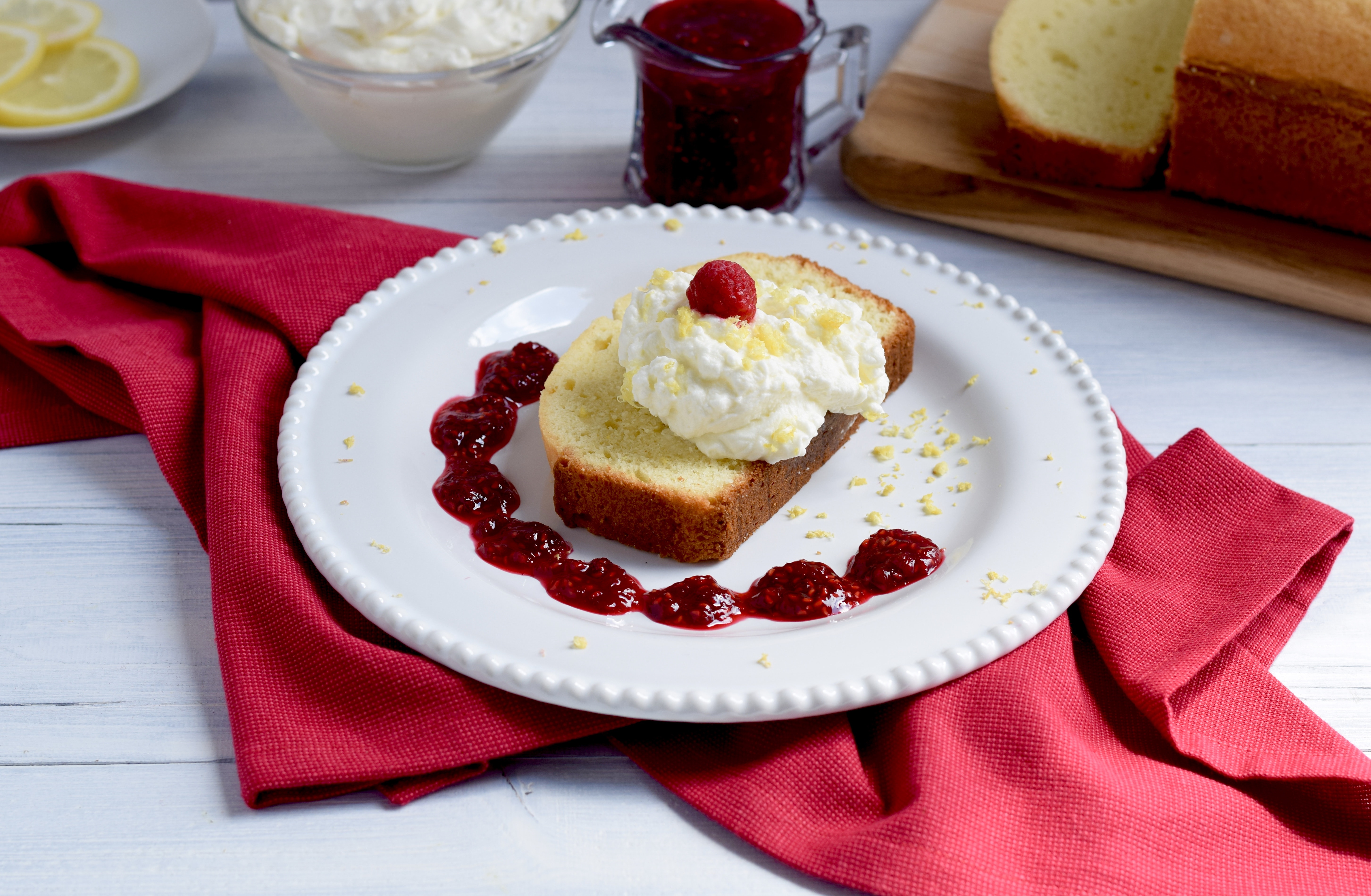 Lemon Pound Cake with Whipped Cream and Raspberry Sauce image