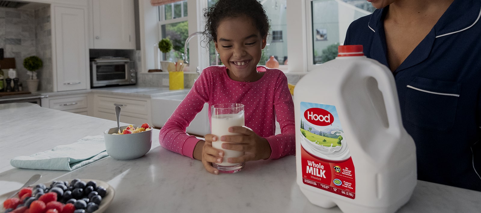 Girl drinking Hood Milk