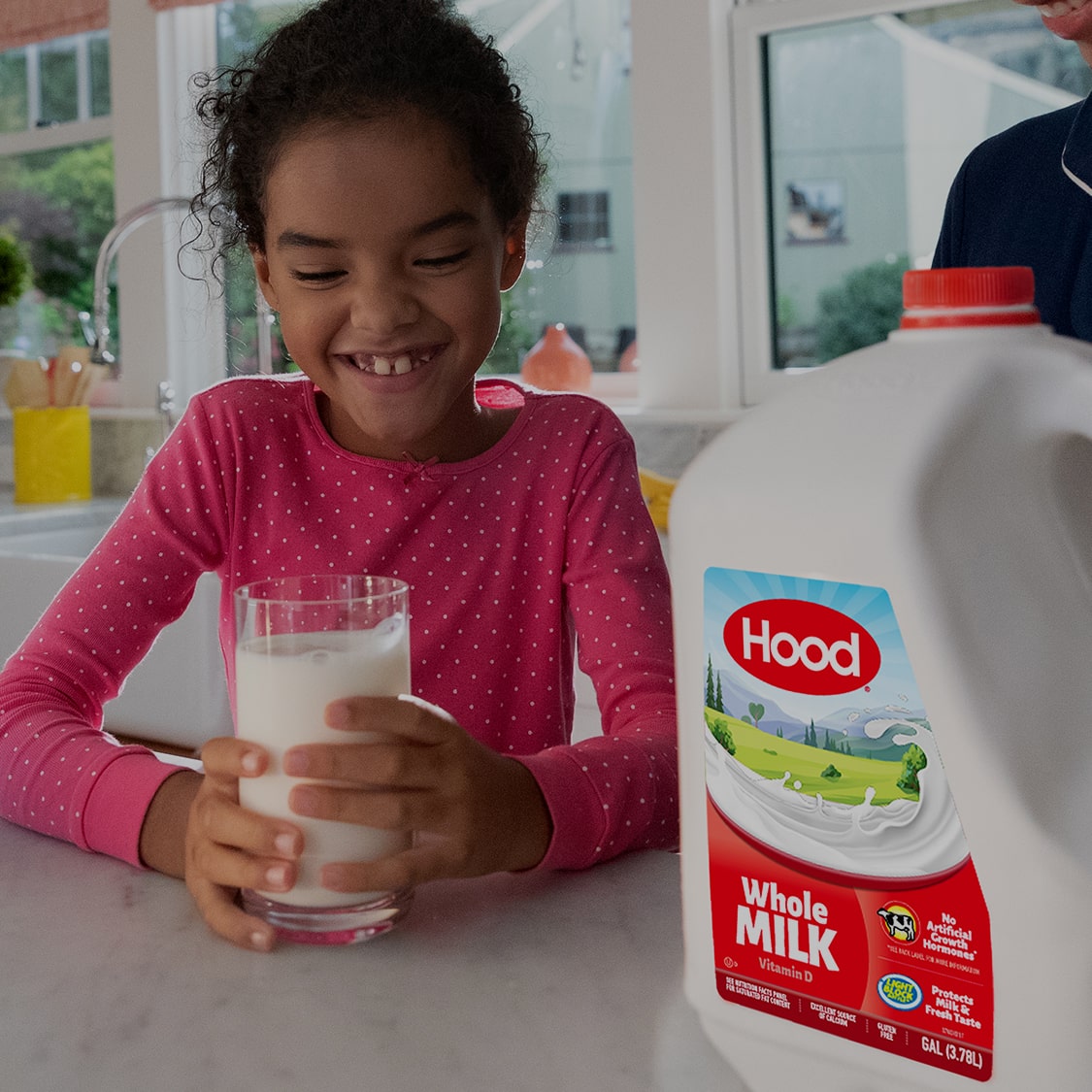 Girl drinking Hood milk